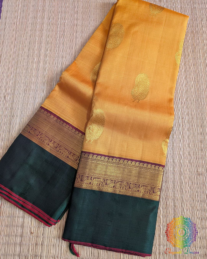 Mustard pure Kanjivaram silk saree with green border and 2 gram zari Elegantt Drapes